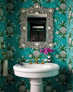 a bedroom with a large bed couch and a window