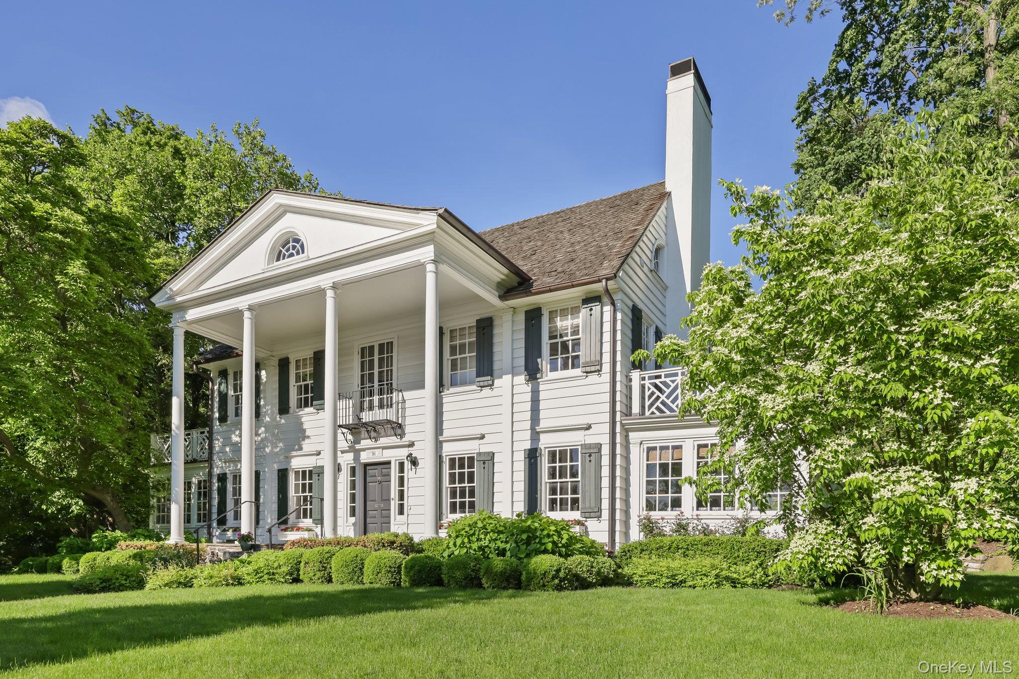 86 Pondfield Road West Bronxville, NY 10708 - Photo 2 of 30 a front view of a house with garden