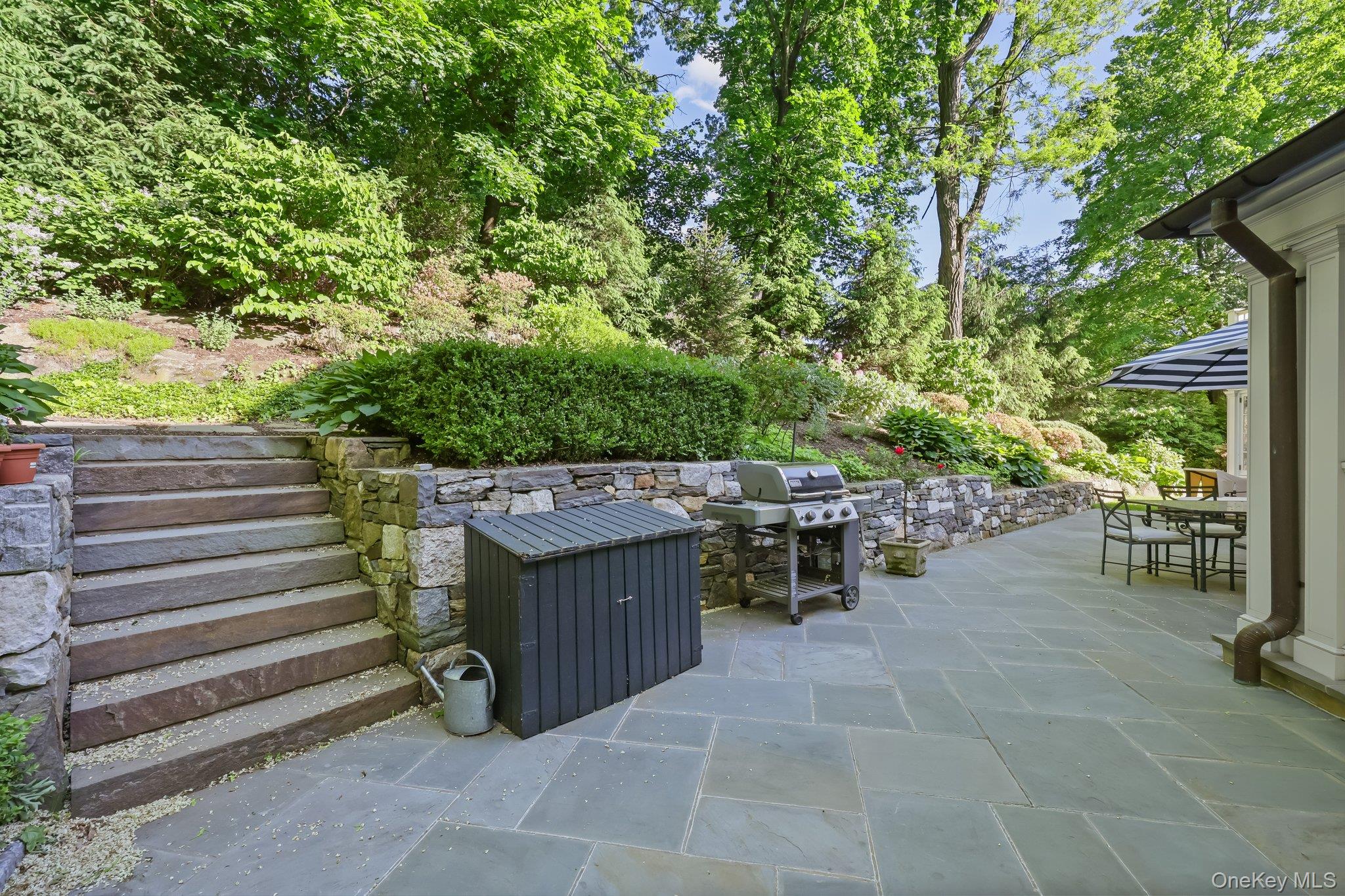 86 Pondfield Road West Bronxville, NY 10708 - Photo 29 of 30 a view of a patio with table and chairs and potted plants