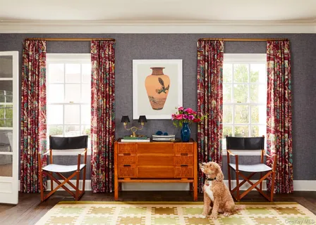a living room filled with furniture and a window