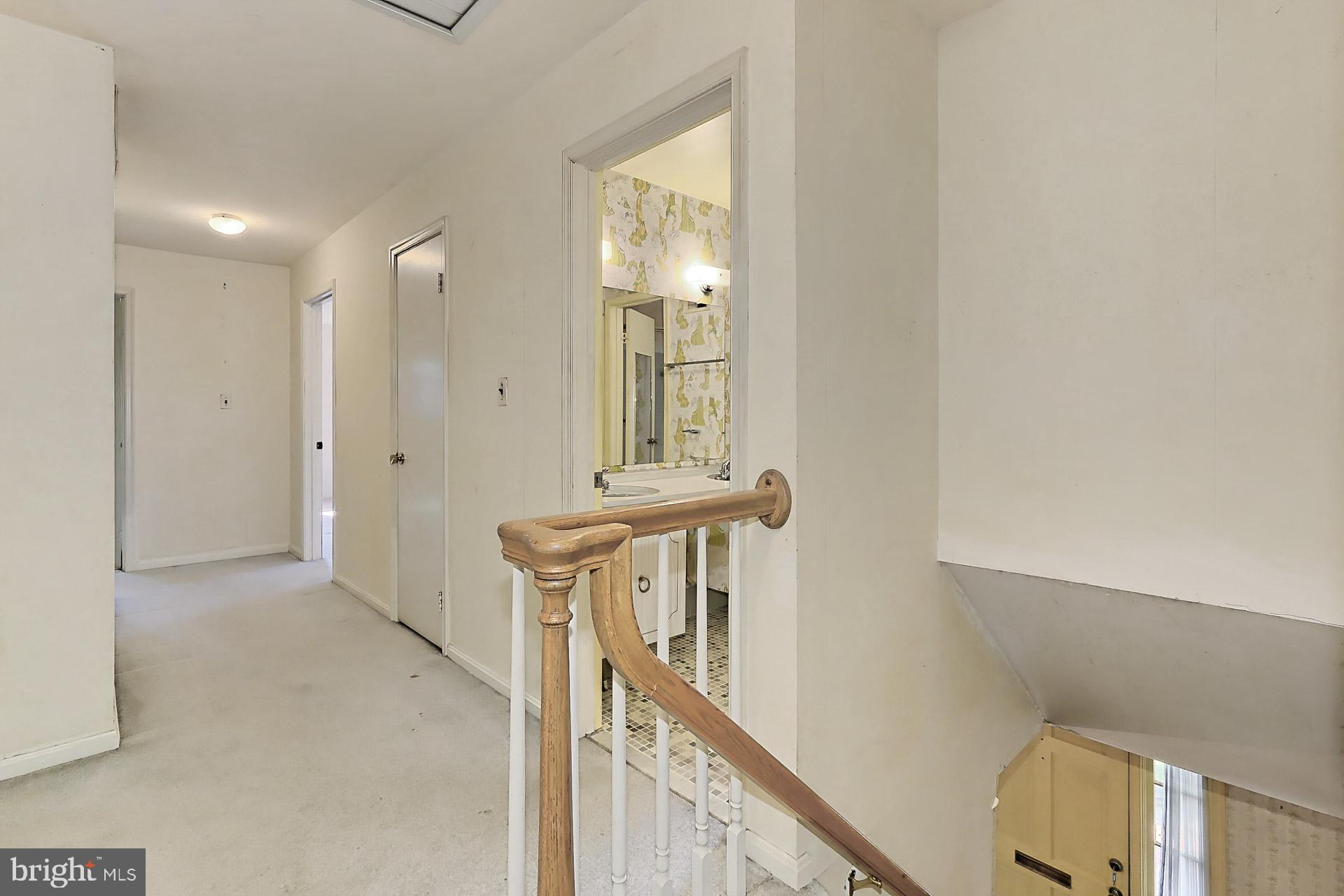 6005 Roxbury Avenue Springfield, VA 22152 - Photo 16 of 45 Wide Upstairs Hallway with All House Attic Fan