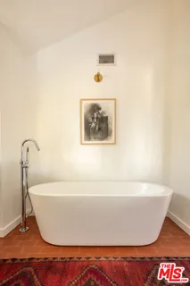 a white bath tub sitting in a bathroom