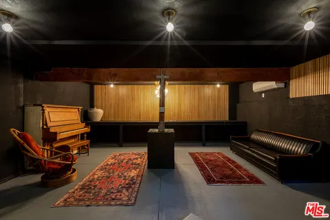 a couch sitting in a room next to a window