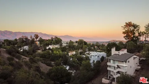 an aerial view of residential house with outdoor space