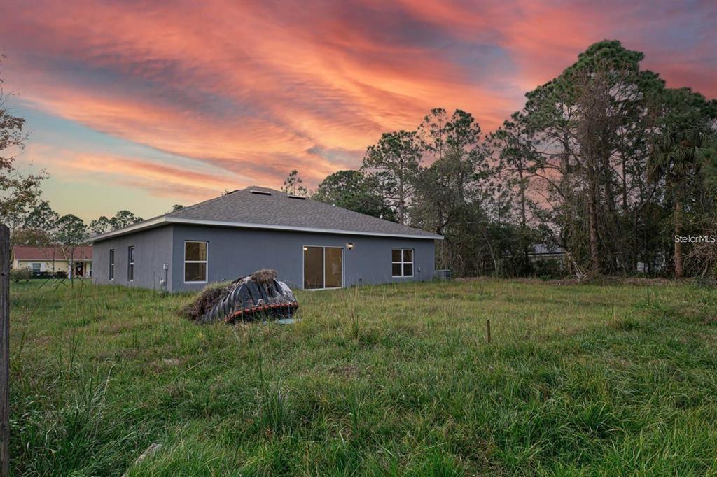 561 Wildmer Road Southwest Palm Bay, FL 32908 - Photo 18 of 19 a house view with a outdoor space