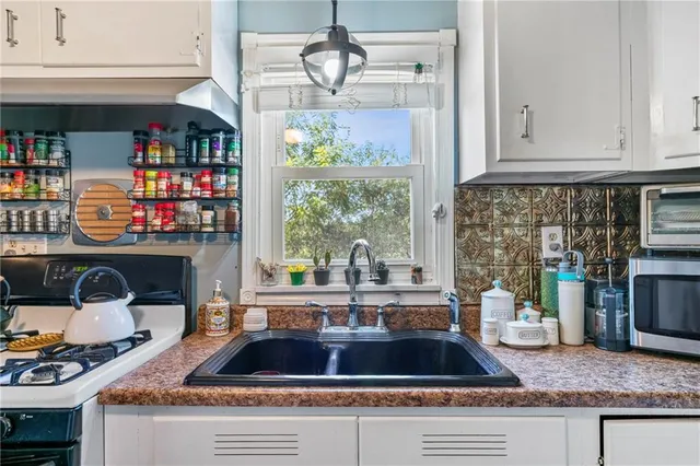 a living room with fireplace furniture and a window