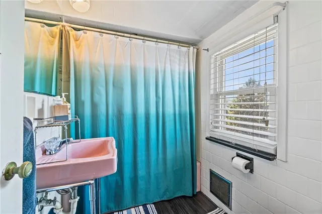 a view of a room with furniture and a window