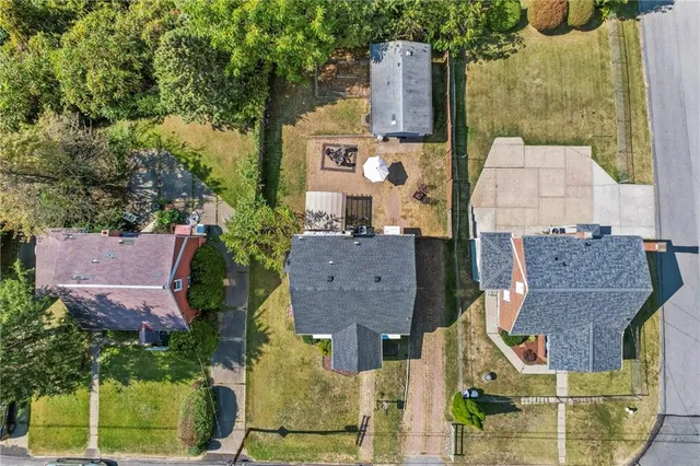 an aerial view of residential houses with outdoor space