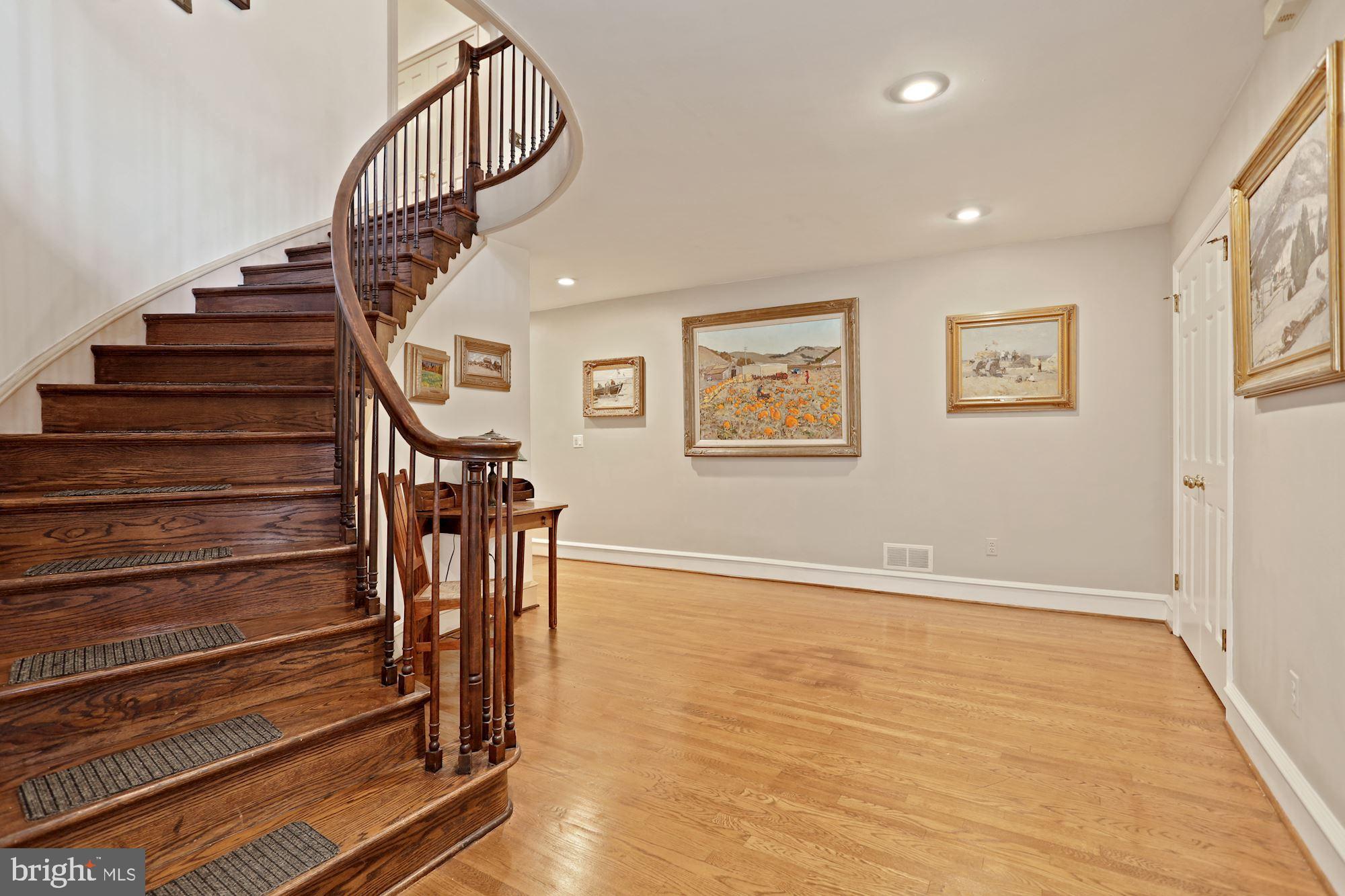 1311 Merrie Ridge Road McLean, VA 22101 - Photo 23 of 54 a view of entryway and hall with wooden floor