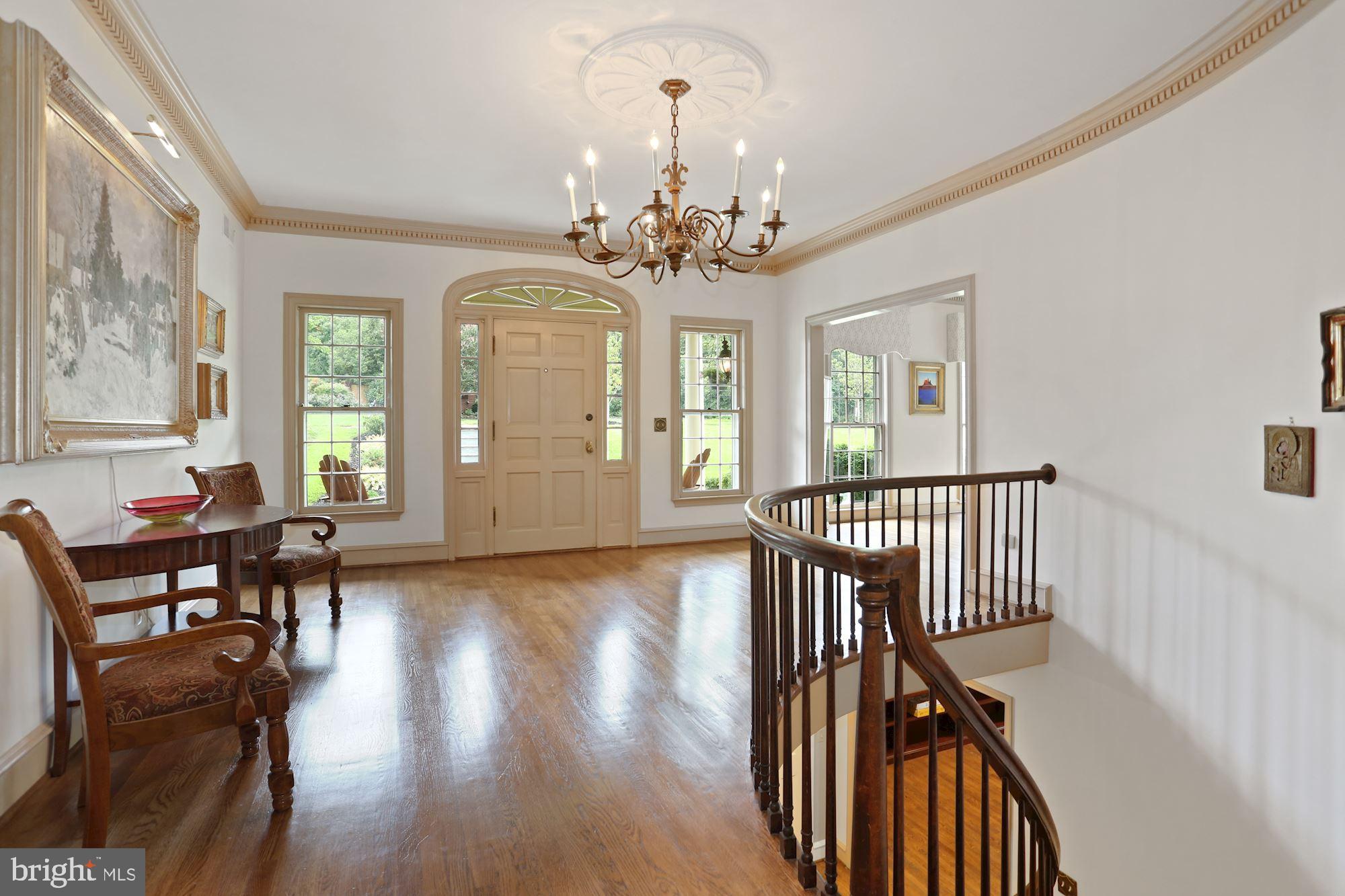1311 Merrie Ridge Road McLean, VA 22101 - Photo 4 of 54 a view of a livingroom with furniture window wooden floor and windows