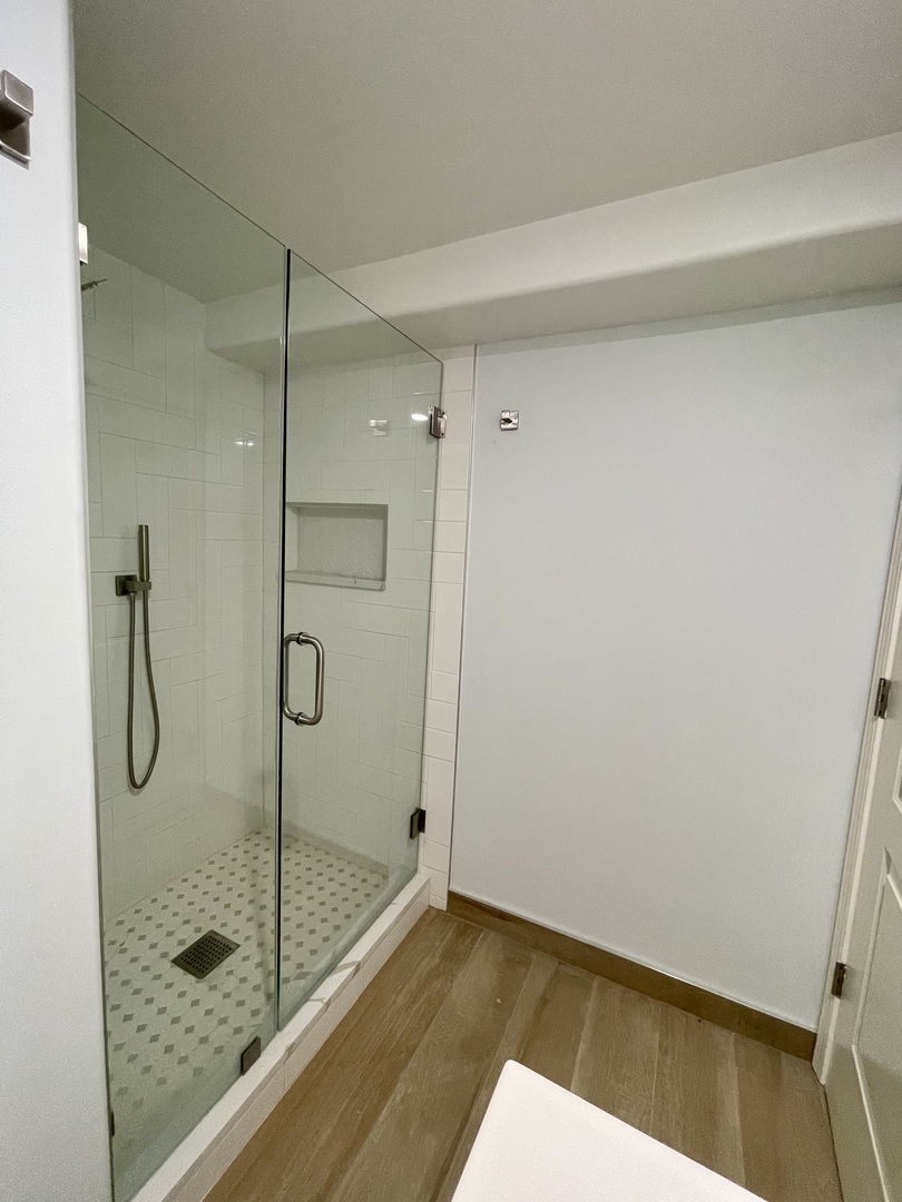 2112 North Sawyer Avenue, Unit I Chicago, IL 60647 - Photo 13 of 30 a bathroom with a glass shower door