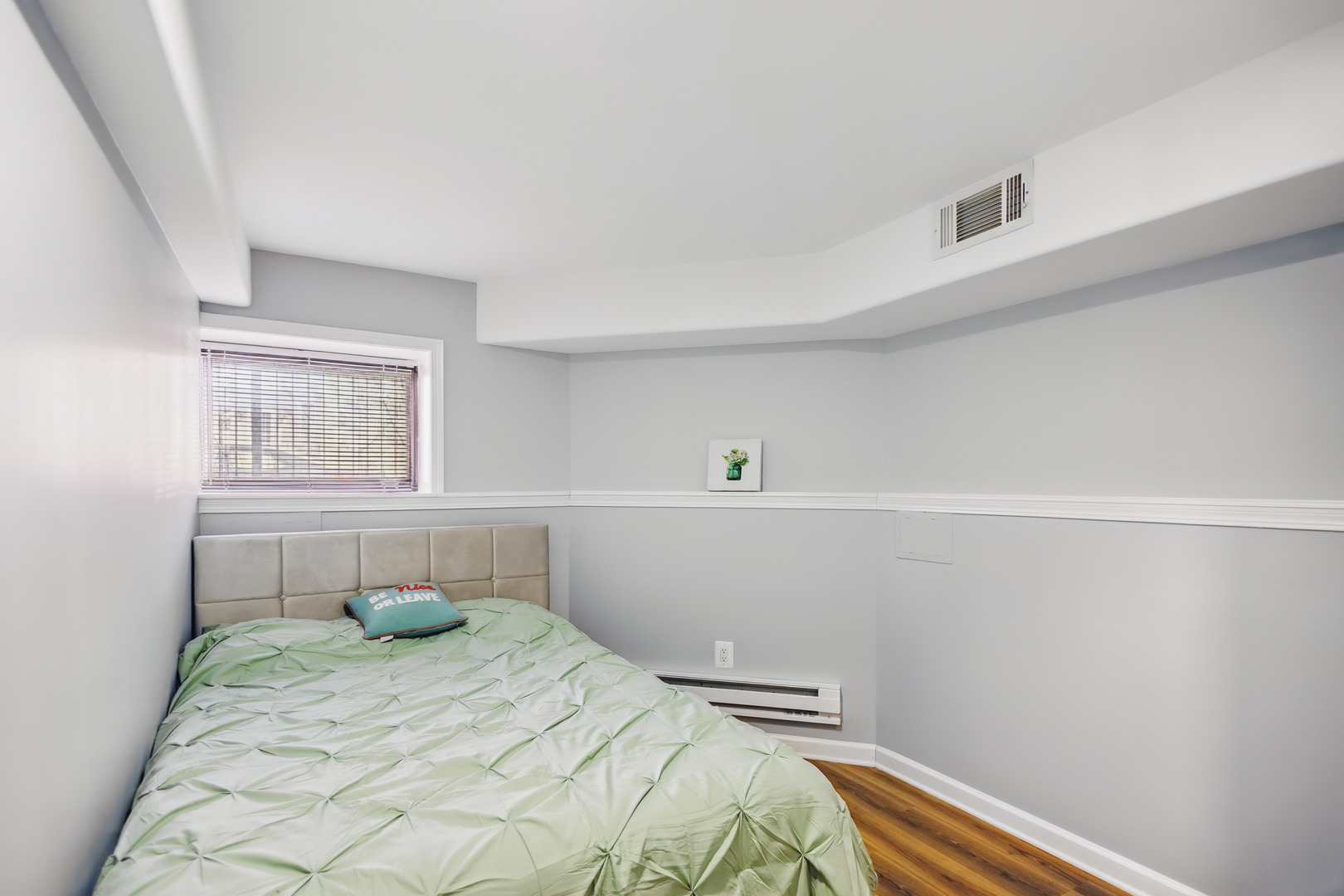 2112 North Sawyer Avenue, Unit I Chicago, IL 60647 - Photo 16 of 30 a bedroom with a bed and a window