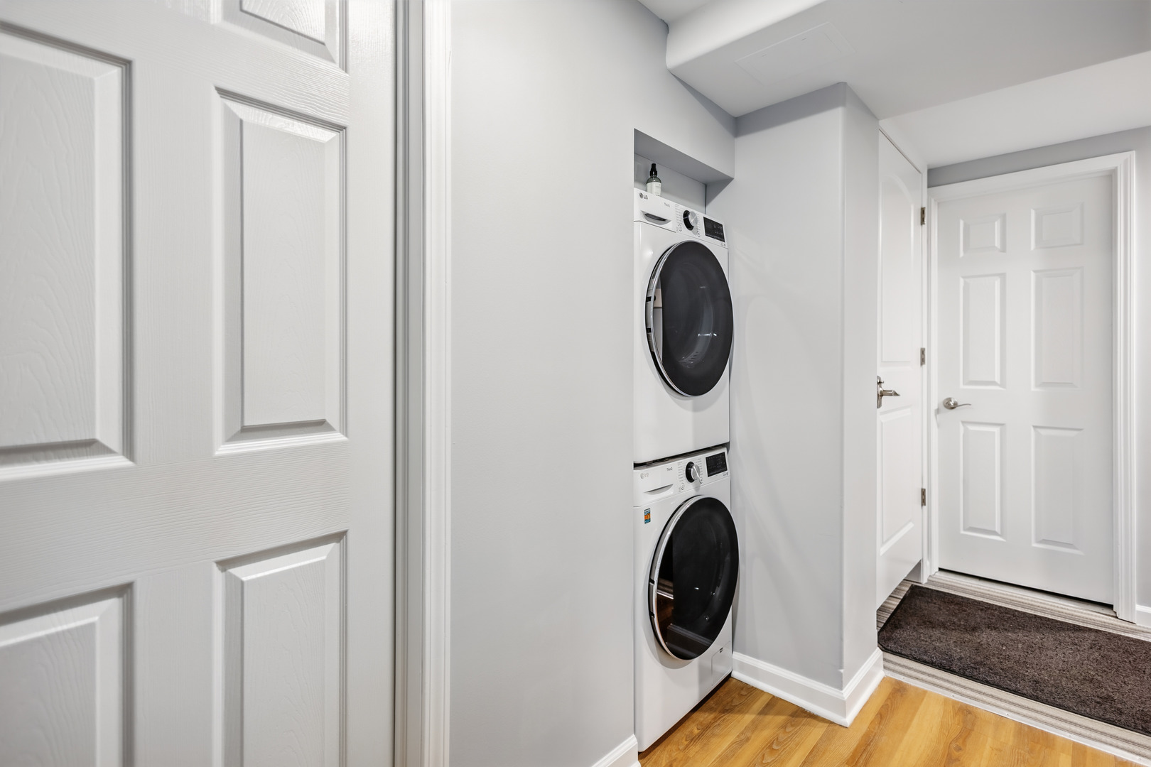 2112 North Sawyer Avenue, Unit I Chicago, IL 60647 - Photo 18 of 30 a view of a bedroom with washer and dryer