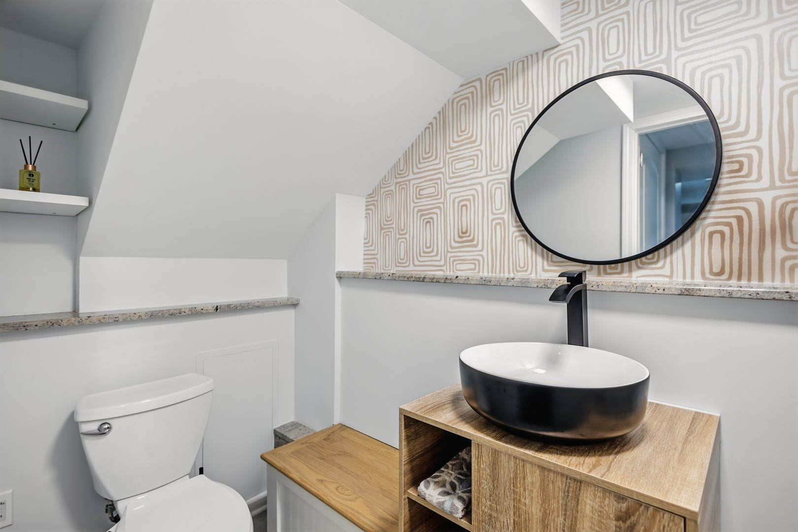 2112 North Sawyer Avenue, Unit I Chicago, IL 60647 - Photo 19 of 30 a bathroom with a toilet a sink and mirror