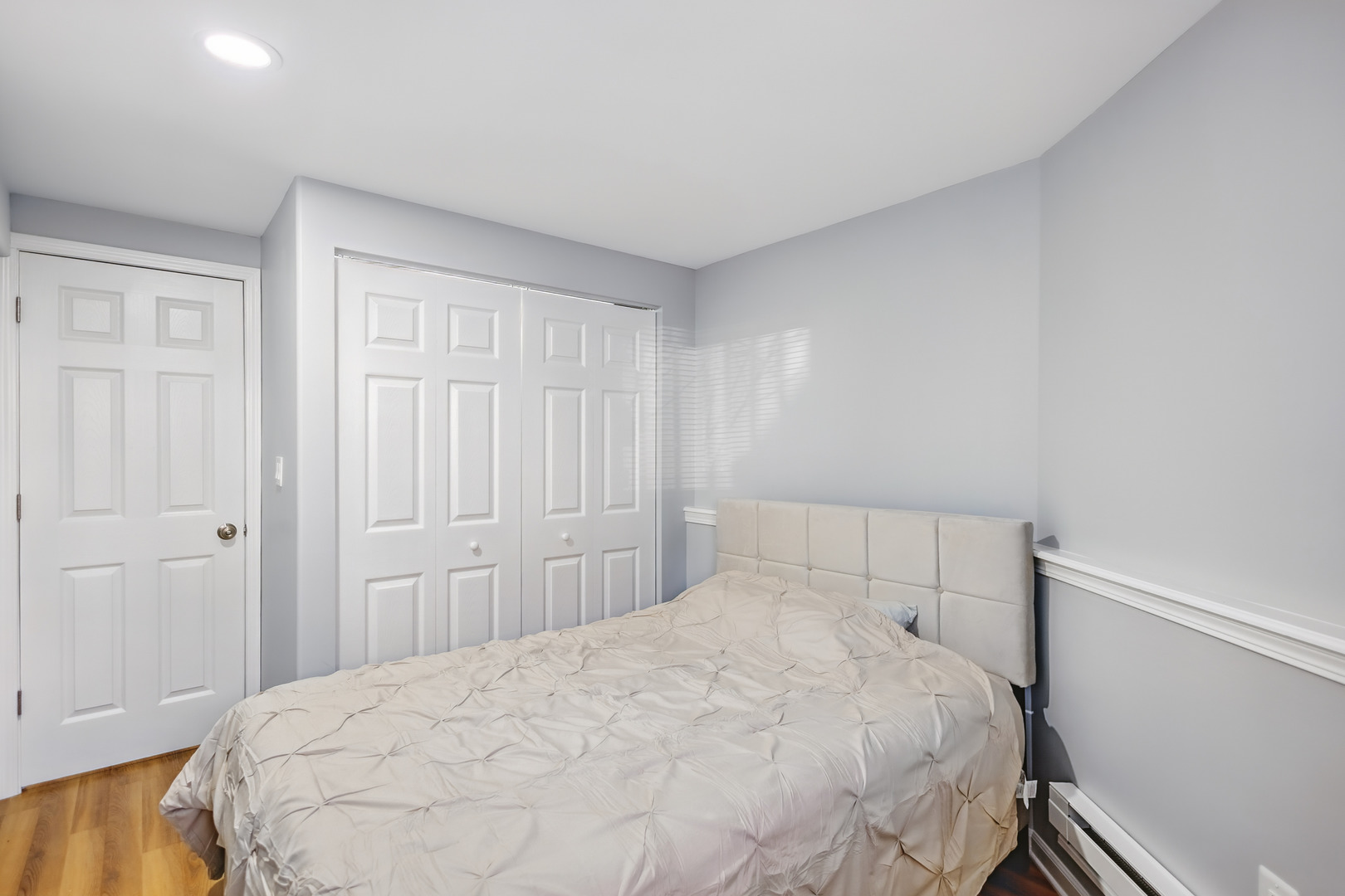 2112 North Sawyer Avenue, Unit I Chicago, IL 60647 - Photo 20 of 30 a bedroom with a bed and a closet
