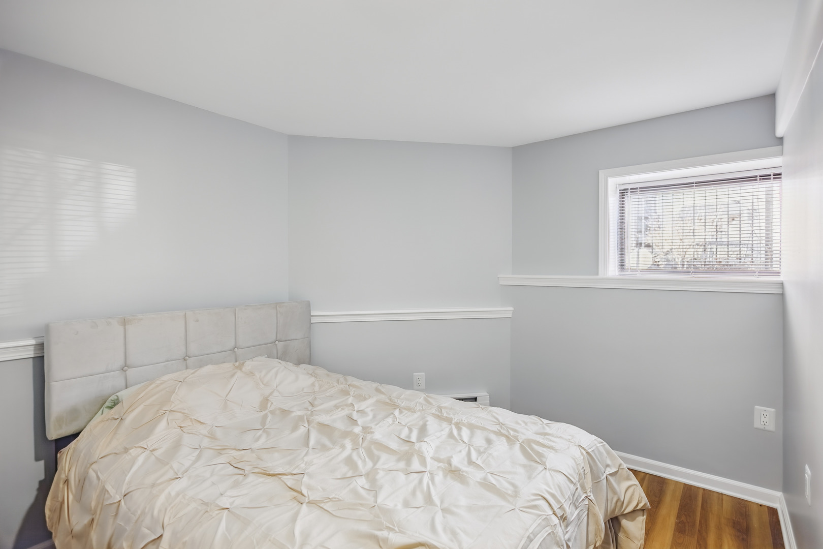 2112 North Sawyer Avenue, Unit I Chicago, IL 60647 - Photo 21 of 30 a bedroom with a bed and a window