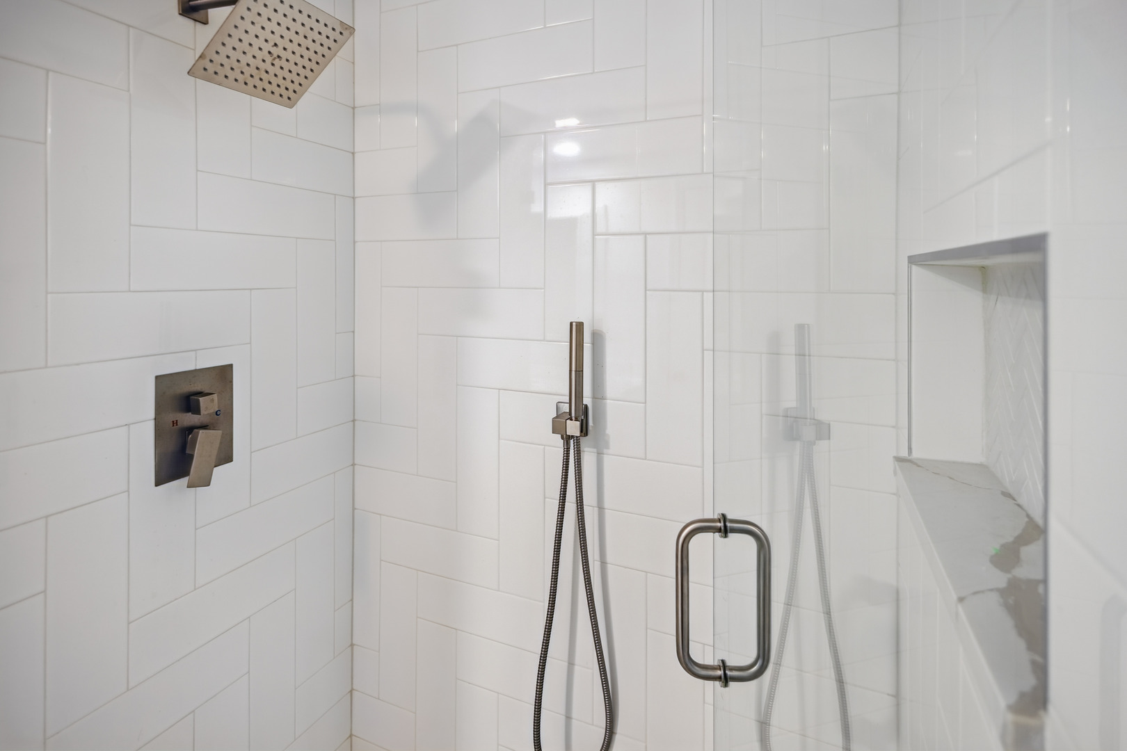 2112 North Sawyer Avenue, Unit I Chicago, IL 60647 - Photo 23 of 30 a bathroom with a granite countertop shower and a sink