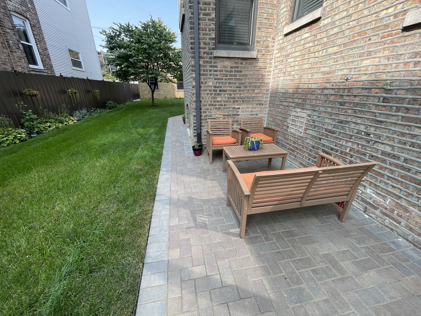 2112 North Sawyer Avenue, Unit I Chicago, IL 60647 - Photo 29 of 30 a backyard of a house with outdoor seating