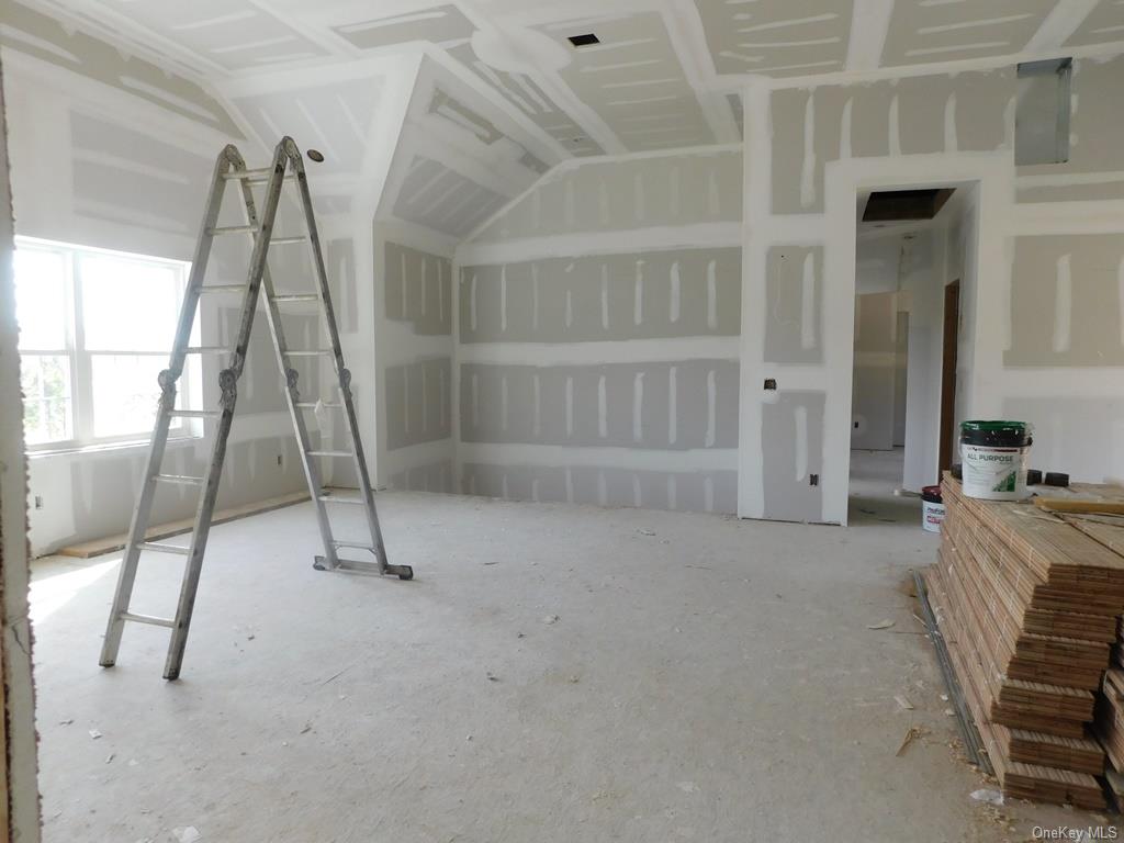 90 Quaker Street Wallkill, NY 12589 - Photo 4 of 19 Unfurnished living room with lofted ceiling