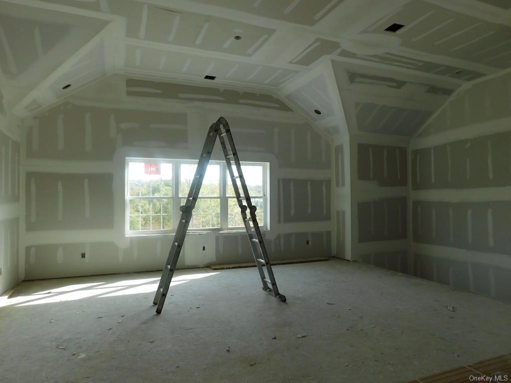 90 Quaker Street Wallkill, NY 12589 - Photo 5 of 19 Unfurnished room featuring vaulted ceiling