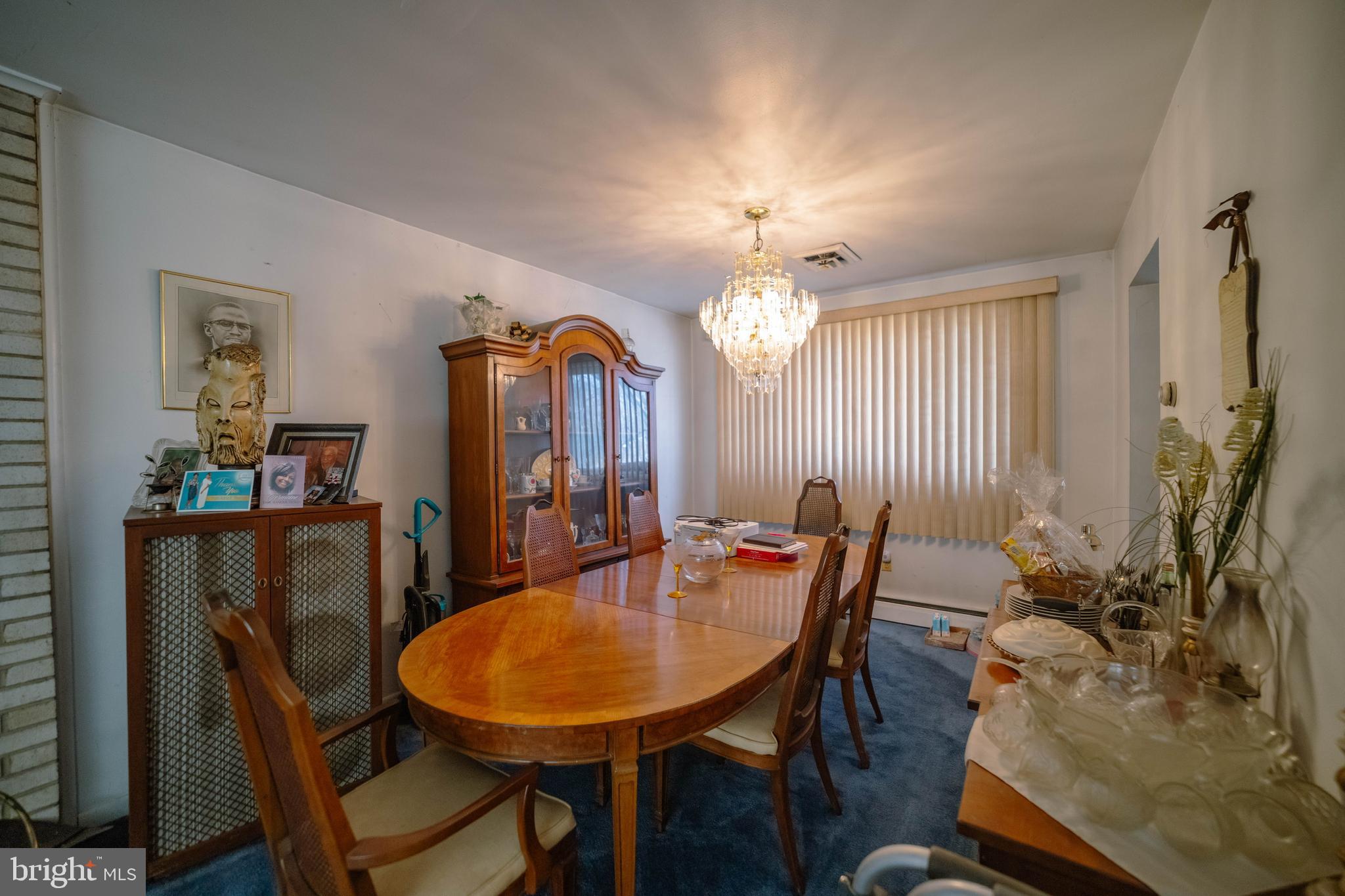 6900 Temple Hill Road Temple Hills, MD 20748 - Photo 22 of 43 a view of a dining room with furniture and a chandelier