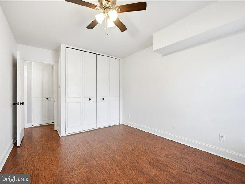 421 Drummers Lane, Unit 421 Wayne, PA 19087 - Photo 16 of 30 wooden floor in an empty room