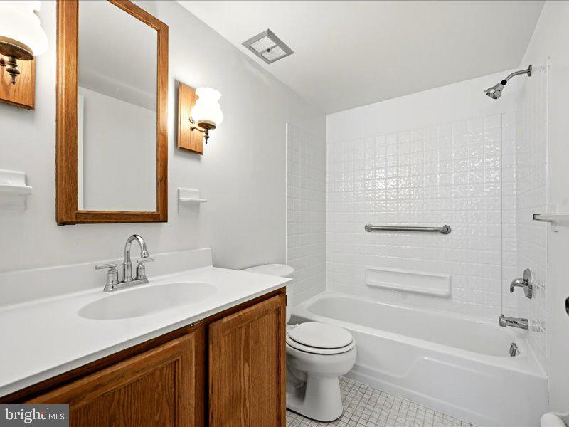 421 Drummers Lane, Unit 421 Wayne, PA 19087 - Photo 19 of 30 a bathroom with a sink a toilet and shower