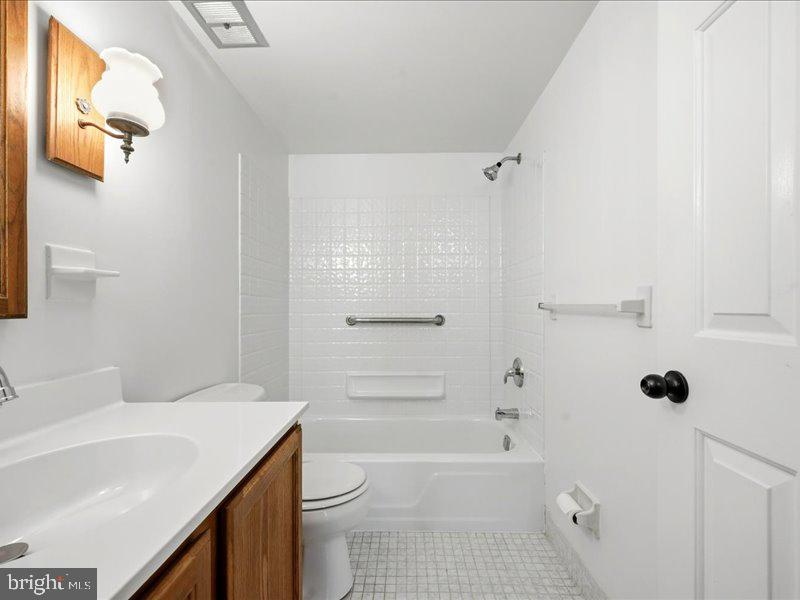 421 Drummers Lane, Unit 421 Wayne, PA 19087 - Photo 20 of 30 a bathroom with a sink a toilet and shower