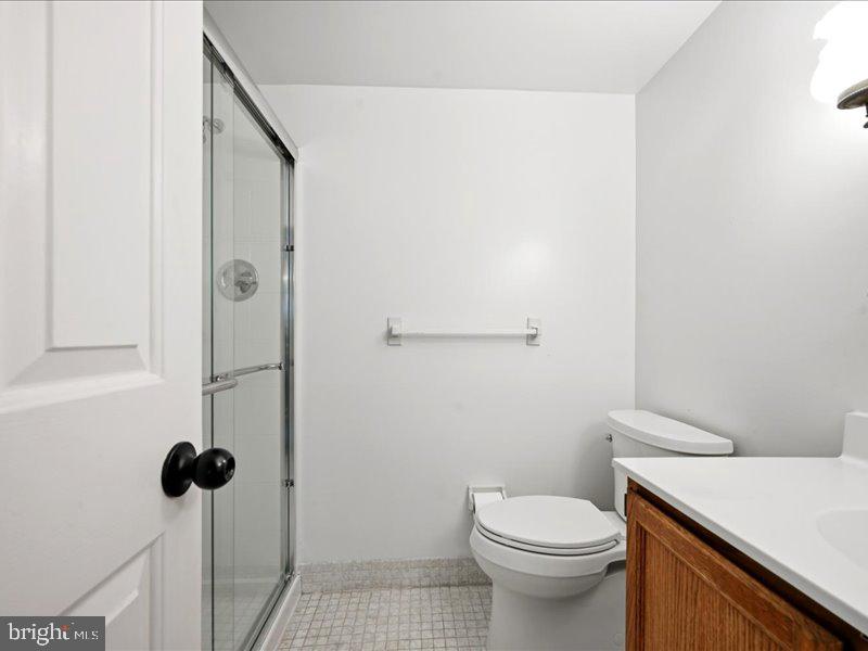 421 Drummers Lane, Unit 421 Wayne, PA 19087 - Photo 27 of 30 a bathroom with a toilet and a shower