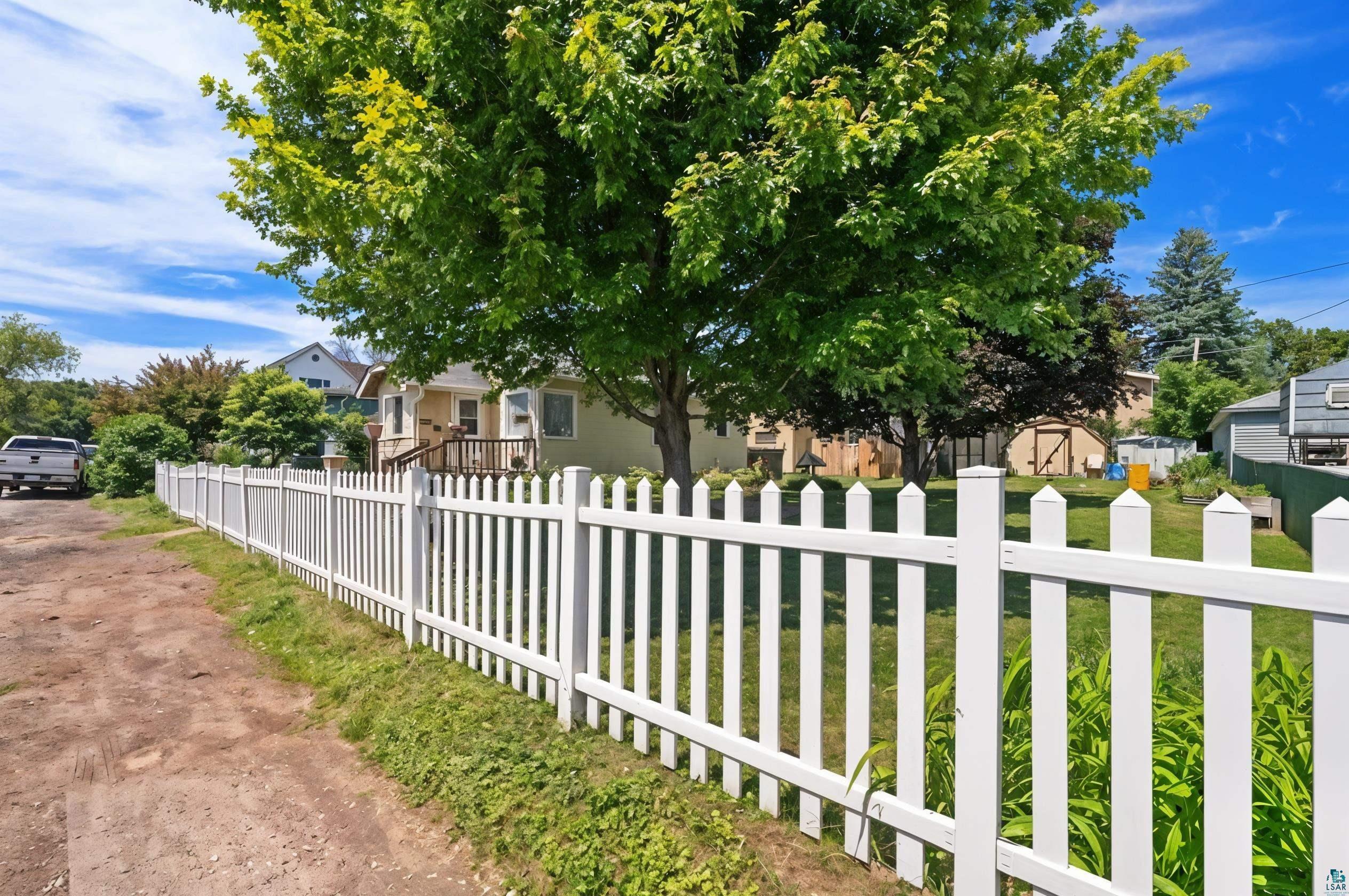 3209 Chestnut Street Duluth, MN 55806 - Photo 23 of 28 White picket fence enclosing a grassy yard