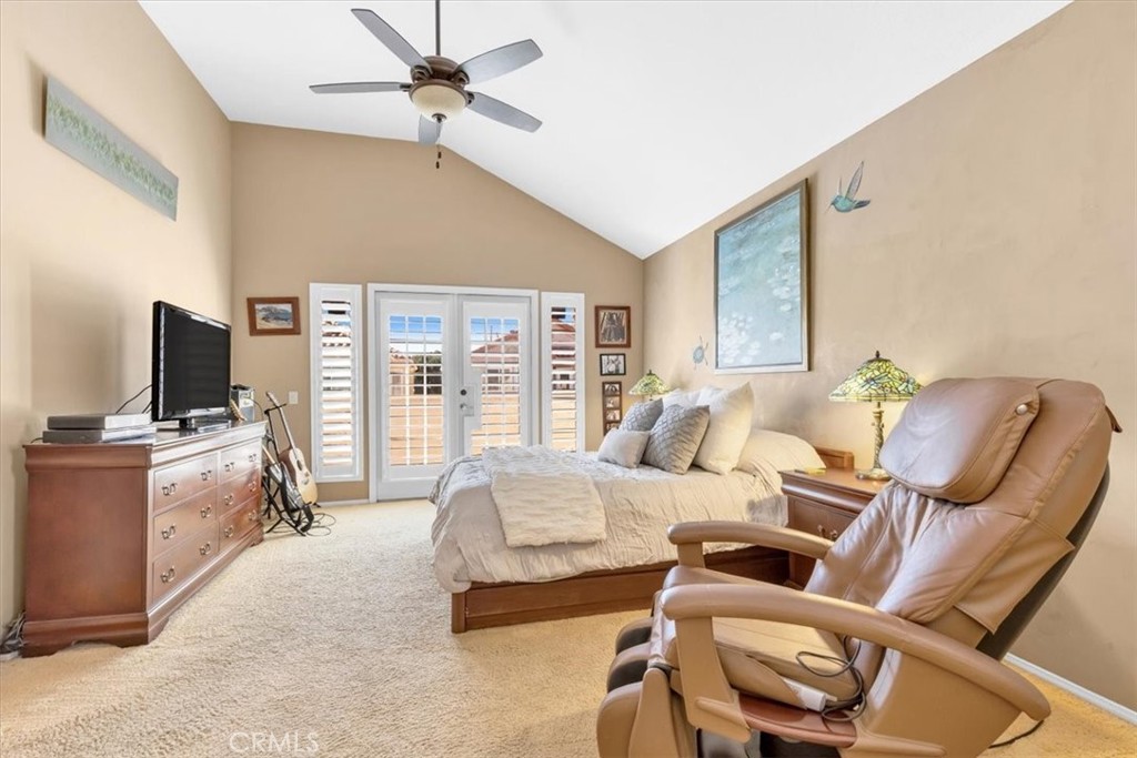 10 St John Dana Point, CA 92629 - Photo 11 of 31 a bedroom with furniture and a flat screen tv