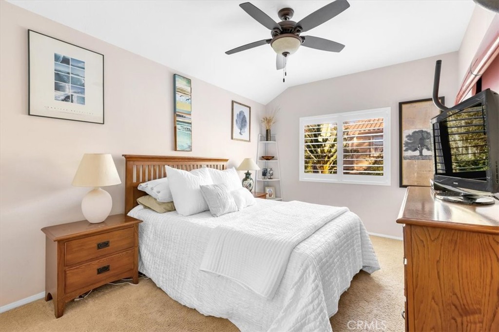 10 St John Dana Point, CA 92629 - Photo 14 of 31 a bedroom with a large bed and a flat tv screen on dresser