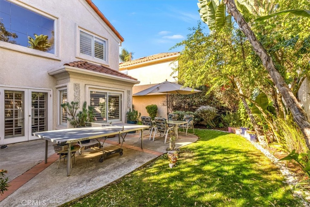 10 St John Dana Point, CA 92629 - Photo 20 of 31 a view of a house with a chairs and table in a patio