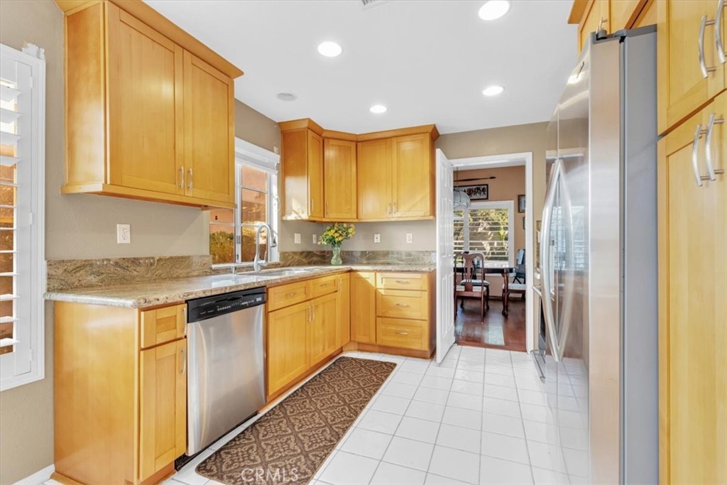 10 St John Dana Point, CA 92629 - Photo 4 of 31 a kitchen with a sink window and cabinets