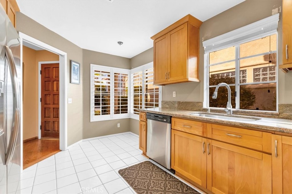 10 St John Dana Point, CA 92629 - Photo 5 of 31 a large kitchen with granite countertop a sink and a window