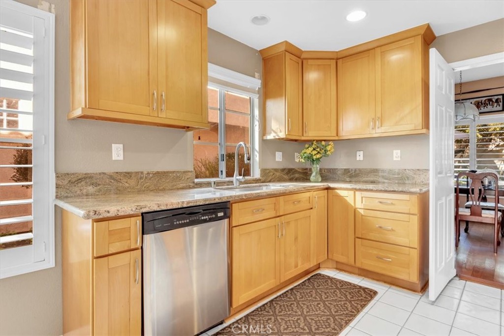 10 St John Dana Point, CA 92629 - Photo 7 of 31 a kitchen with stainless steel appliances granite countertop a sink and cabinets
