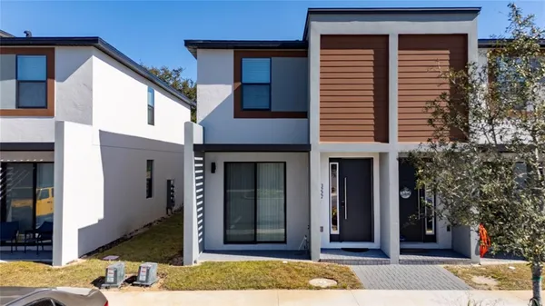 a front view of a house with a yard
