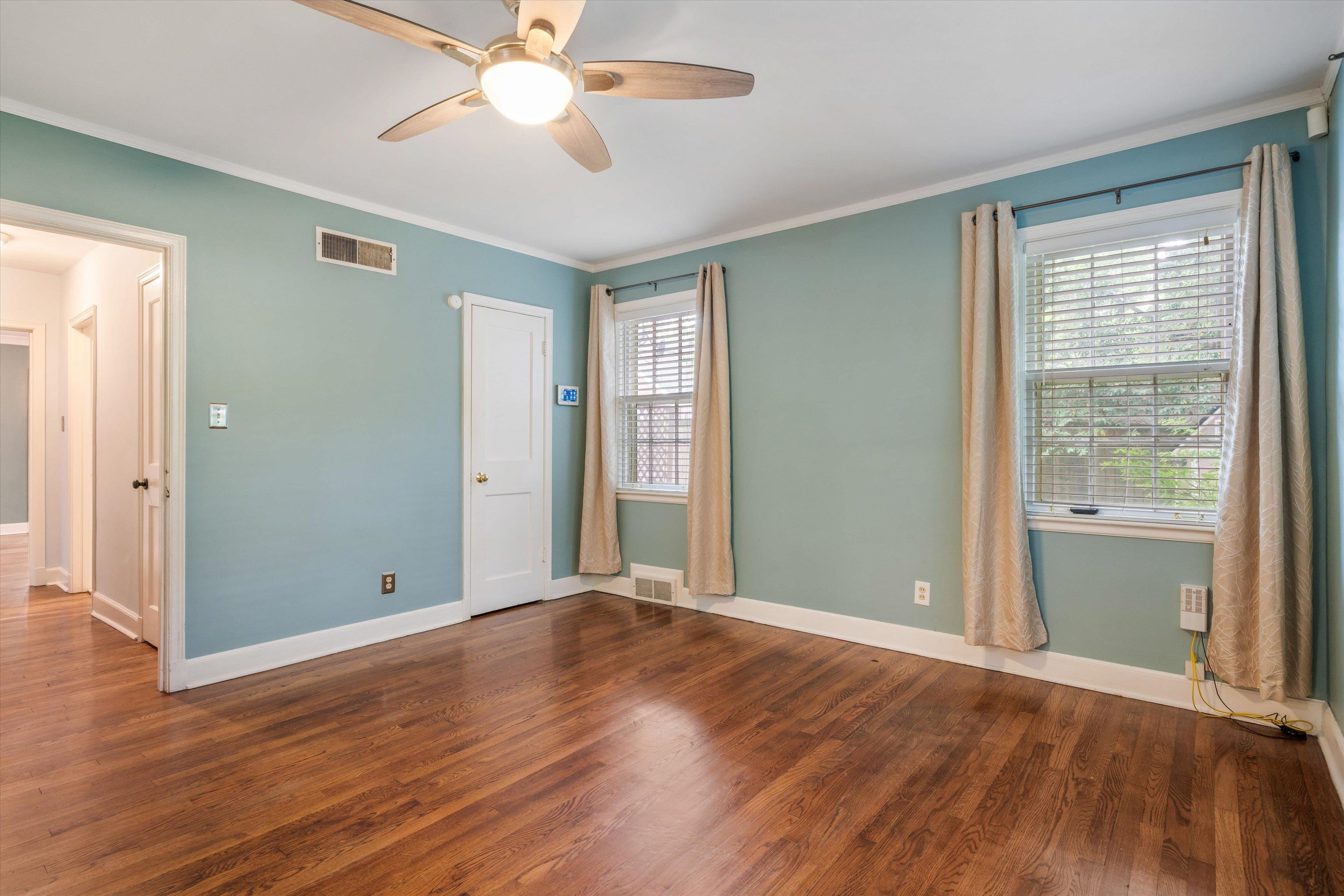 17 North Ashlawn Road Memphis, TN 38112 - Photo 17 of 28 Unfurnished bedroom featuring crown molding, dark wood-style floors, and ceiling fan