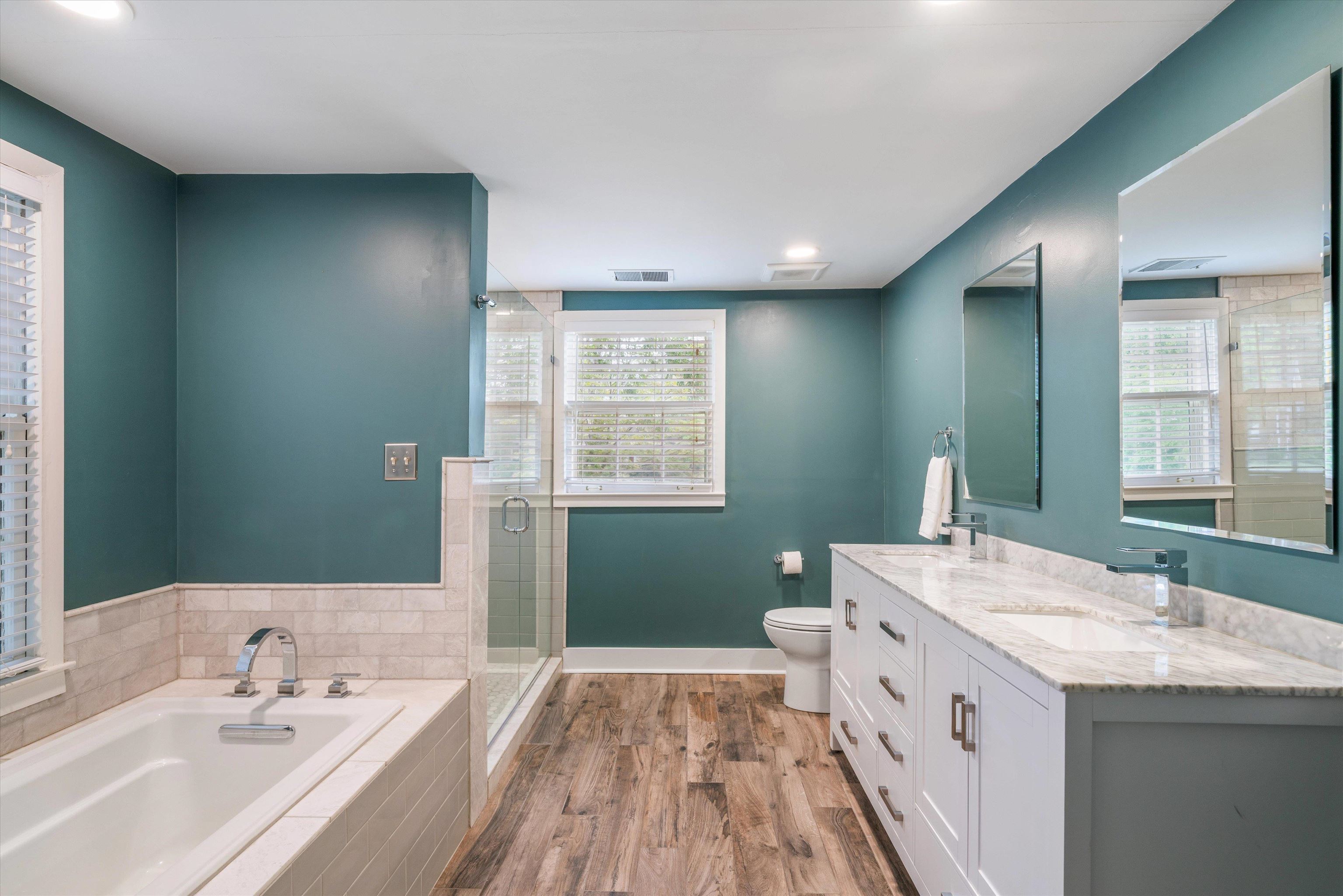 17 North Ashlawn Road Memphis, TN 38112 - Photo 19 of 28 Full bathroom with a garden tub, double vanity, dark wood finished floors, a stall shower, and recessed lighting