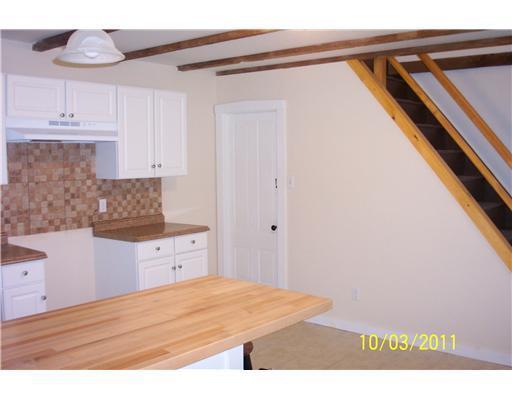 115 Libby Hill Road Gardiner, ME 04345 - Photo 8 of 19 Kitchen. Kitchen exposing the back...
