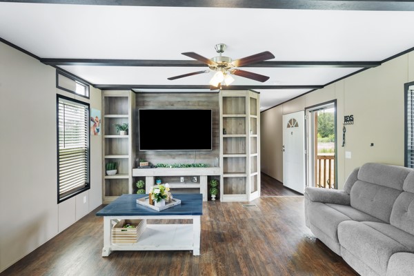 148 A Rogers Road New Waverly, TX 77358 - Photo 13 of 31 a living room with furniture and a flat screen tv