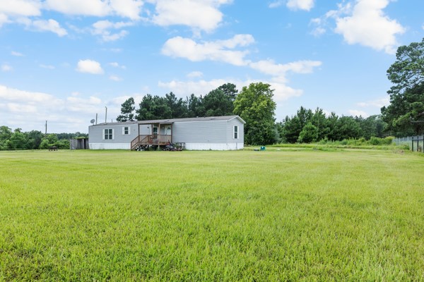 148 A Rogers Road New Waverly, TX 77358 - Photo 26 of 31 a view of a house with a big yard