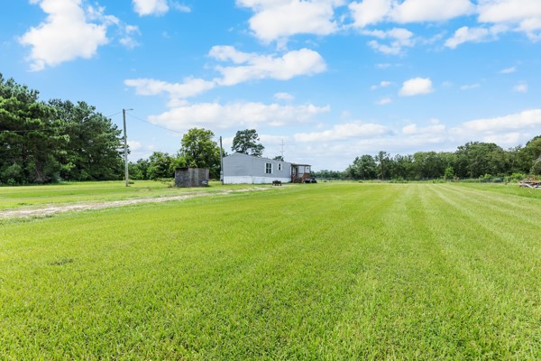 148 A Rogers Road New Waverly, TX 77358 - Photo 27 of 31 a view of a volley ball court