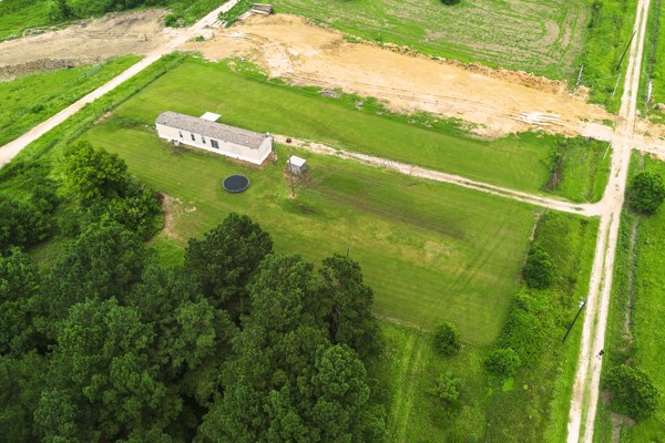 148 A Rogers Road New Waverly, TX 77358 - Photo 29 of 31 a view of a green yard with an ocean