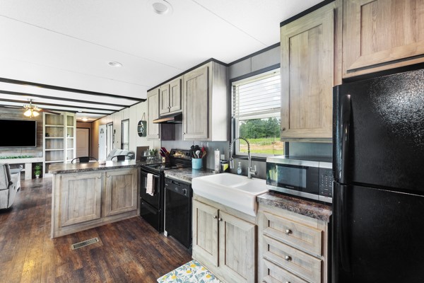 148 A Rogers Road New Waverly, TX 77358 - Photo 3 of 31 a kitchen with a refrigerator stove and sink