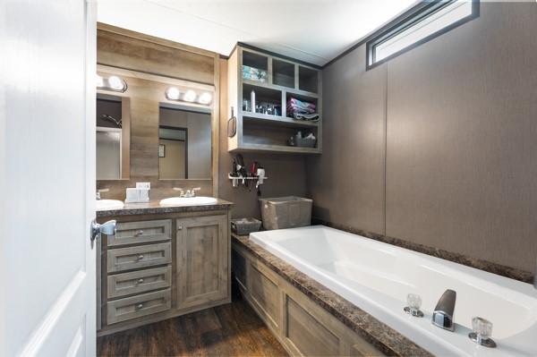 148 A Rogers Road New Waverly, TX 77358 - Photo 6 of 31 a bathroom with a granite countertop sink a vanity and a