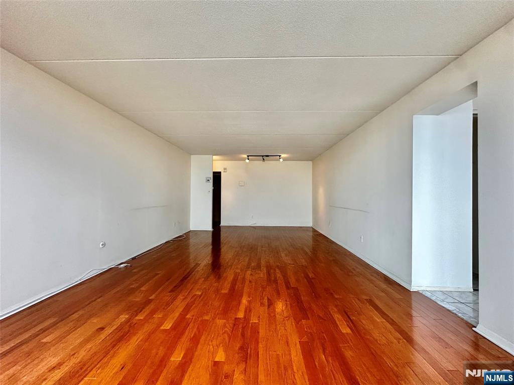 250 Gorge Road, Unit 23A Cliffside Park, NJ 07010 - Photo 11 of 41 a view of empty room with wooden floor