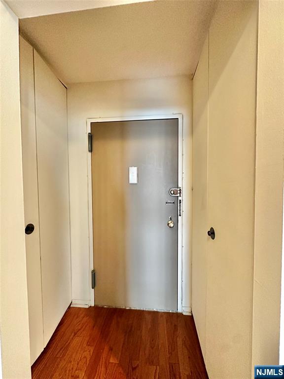 250 Gorge Road, Unit 23A Cliffside Park, NJ 07010 - Photo 17 of 41 a view of a hallway with wooden floor