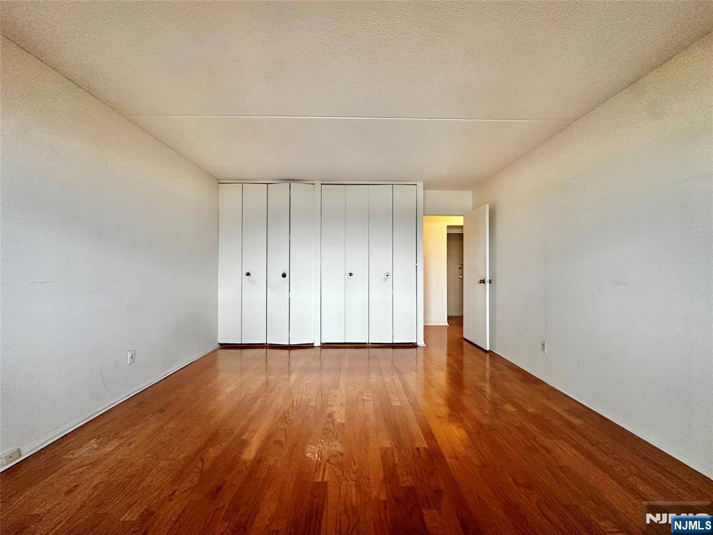 250 Gorge Road, Unit 23A Cliffside Park, NJ 07010 - Photo 20 of 41 a view of an empty room and wooden floor