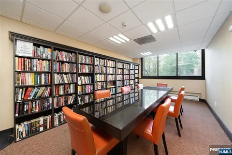 a kitchen with a sink stainless steel appliances and cabinets